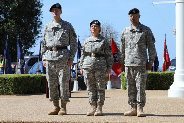 HONOLULU -- From left to right: Brig. Gen. Keith Gallagher, outgoing commander of Pacific Regional Medical Command and Tripler Army Medical Center; Lt. Gen. Patricia Horoho, U.S. Army Surgeon General and commander, U.S. Army Medical Command; and Col. J. Anson Smith, incoming commander for PRMC and TAMC, stand ready to perform the traditional passing of the colors during a change of command ceremony at the TAMC Flag Pole, Oct. 4.