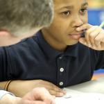 Secretary Duncan visits with a student at DC's Walker-Jones Education Campus.