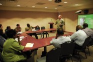Lt. Paul O'Leary, commander of Headquarters and Headquarters Company, 1st Battalion, 124th Infantry Regiment, presents a briefing on youth violence and gang awareness during a subject matter exchange seminar in Bridgetown, Barbados, Aug. 30, 2011. Soldiers from the Florida National Guard and the Virgin Islands National Guard participated in the exchange to address youth and gang violence in the Caribbean. Photo by Sgt. 1st Class Blair Heusdens