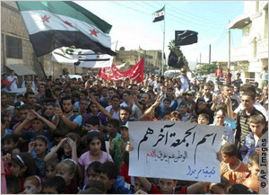 Opponents of the Assad regime demonstrate in Idlib province October 12. Rice says Syrians are administering towns, reopening schools and rebuilding economies in areas under opposition control.