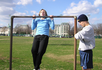 Female student doing a flexed arm hang.