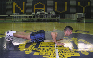 Young man in pushup down position