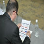 Man reading document. (Photo Credit: Saher Altwal)