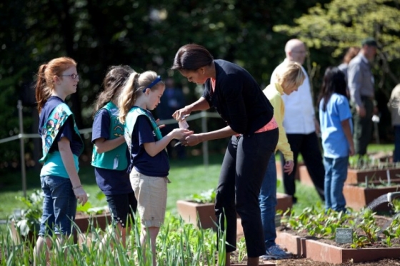 First Lady Michelle Obama gives seeds to girls from Girl Scout Troop 60325 