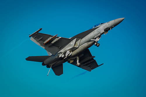 <p>A U.S. Navy F/A-18F Super Hornet aircraft assigned to Strike Fighter Squadron (VFA) 154 flies over the aircraft carrier USS Nimitz (CVN 68) in the Pacific Ocean Oct. 18, 2012. Nimitz was under way participating in a composite training unit exercise in the U.S. 3rd Fleet area of responsibility. (DoD photo by Mass Communication Specialist 3rd Class Raul Moreno Jr., U.S. Navy/Released)</p>