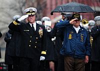 Rear Adm. Patrick J. Lorge and Frank Yanick render honors during a wreath laying ceremony at the U.S. Navy Memorial.