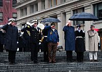 Rear Adm. Patrick J. Lorge, Frank Yanick and Rear Adm. Edward Walker Jr. render honors during a wreath laying ceremony at the U.S. Navy Memorial.