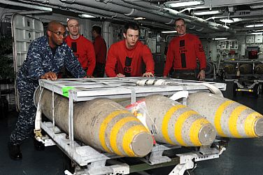 Sailors assigned to the weapons department aboard the aircraft carrier USS Enterprise (CVN 65) transport 1,000-pound bombs on the forward mess decks for transfer to the Military Sealift Command dry cargo and ammunition ship USNS Sacagawea (T-AKE 2). This is the last ammunition offload before returning to homeport. Enterprise is completing its final scheduled deployment to the U.S. 5th and 6th Fleet areas of responsibility in support of maritime security operations and theater security cooperation efforts. America’s Sailors are Warfighters, a fast and flexible force deployed worldwide. Join the conversation on social media using #warfighting.  U.S. Navy photo by Mass Communication Specialist 3rd Class Jared King (Released)  121024-N-CH661-056