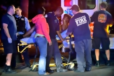 In this photo taken Sept. 15, 2012, police investigate the scene of a shooting on Chicago's south side. In the coming days, the city is bound to reach another grim milestone when the number of homicides for 2012 surpasses 433, the total for all of last year. (AP Photo/Chicago Sun-Times, Brian Jackson) CHICAGO LOCALS OUT; MAGS OUT *** Local Caption *** Chicago Homicides.JPEG-0db1e.jpg