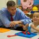 Secretary Duncan with a Hamburg Pre-Kindergarten student