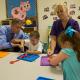 Secretary Duncan with a Hamburg Pre-Kindergarten student