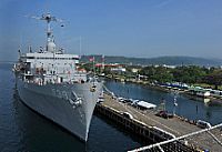 The submarine tender USS Emory S. Land (AS-39) is moored pierside in Subic Bay.