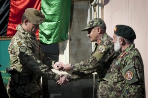 NATO Training Mission – Afghanistan’s Deputy Commander Army British Brigadier Gen. James Stevenson passes the Mentor House Infantry School keys to Afghan National Army Senior Officer Col. Abdul Salur during a handover ceremony at Camp Julian, Dec. 31. (U.S. Air Force photo by Senior Airman Andrea Salazar)