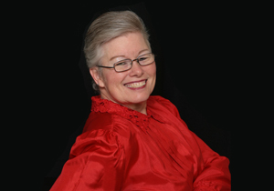 Portrait of a smiling woman in a red blouse