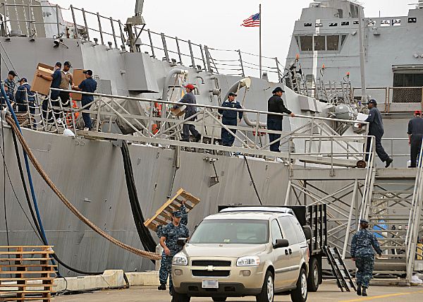 Sailors assigned to the guided-missile destroyer USS Bulkeley (DDG 84) load supplies as the ship prepares to sortie in advance of Hurricane Sandy.  Adm. Bill Gortney, commander of U.S. Fleet Forces Command, ordered the sortie of Navy ships in the Hampton Roads, Va., area.  U.S. Navy photo by Mass Communication Specialist 1st Class Rafael Martie (Released)  121026-N-QY430-004