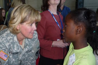 Lt. Gen. Patricia E. McQuistion, AMC Deputy Commanding General, talks with 4th grader Dyani Peters about what it's like to be an Army General at the Girls' Science & Engineering Day, October 20th.