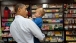 President Obama Holds a Child in Mast General Store