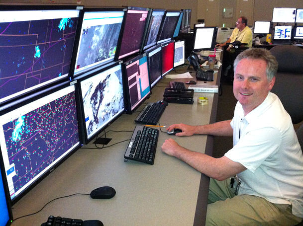 AWC's National Aviation Meteorologist (NAM) Brandon Smith trying out the new NAWIPS, AWIPS II Thin Client, and FAA Traffic Flow Management System installed at the Air Traffic Control System Command Center.
