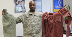 Chief Warrant Officer 3 Samuel Banks, a survivor from a Liberian refugee camp in the Ivory Coast, holds up the only things he had with him when he was forced to flee his home country of Liberia, when rebels led by the extremist Charles Taylor invaded from the north and purged entire cities of their citizens. (U.S. Army photo by Staff Sgt. Matthew Winstead, U.S. Army Alaska)