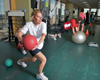 Image of woman exercising in gym