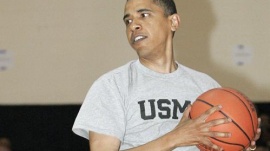 Then-presidential candidate Barack Obama holds onto a rebound during basketball game during a campaign stop in Kokomo, Indiana April 25, 2008. REUTERS/Frank Polich