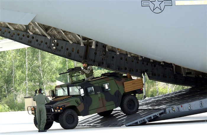 RAMSTEIN, Germany – A loadmaster directs a Humvee from the 230th Military Police Company exiting a C-17 Globemaster III during Operation Vigilant Star at Ramstein Air Base, Germany, on Wednesday, May 24, 2006. The purpose of this operation was to showcase the capabilities of the C-17 to NATO countries. (DoD photo by Air Force Senior Airman Chris Willis) 