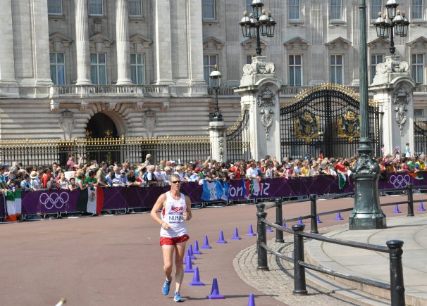 U.S. Army World Class Athlete Program race walker Staff Sgt. John Nunn passes the front gate of Buckingham Palace, Aug. 11, 2012, in London during the 50k race walk competition. Nunn came in 43rd place after posting a time of 4:03:28, a new personal best. Russia's Sergey Kirdyapkin won the gold medal with a new Olympic record time of 3:35:59.