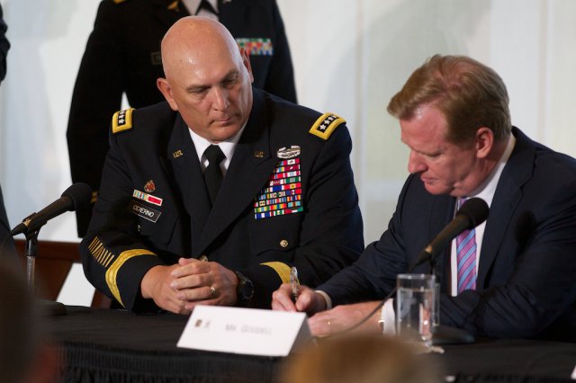 Army Chief of Staff Gen. Ray Odierno and NFL commissioner Roger Goodell sign a letter Aug. 30 formalizing the initiative between the Army and the NFL to help raise awareness about traumatic brain injury.