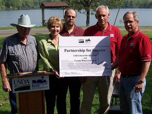 Fayette Water Company board members join Illinois State Director Colleen Callahan after signing a certificate of partnership. 