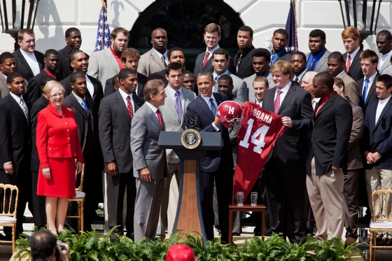 University of Alabama present President Obama with a jersey and helmet  