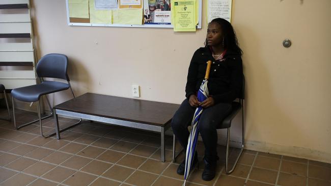 Shandola Williams waits in an employment office on May 14, 2012 in Utica, New York. (Photo by Spencer Platt/Getty Images)