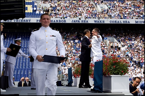 President Barack Obama chest-bumps a graduate at the U.S. Naval Academy 