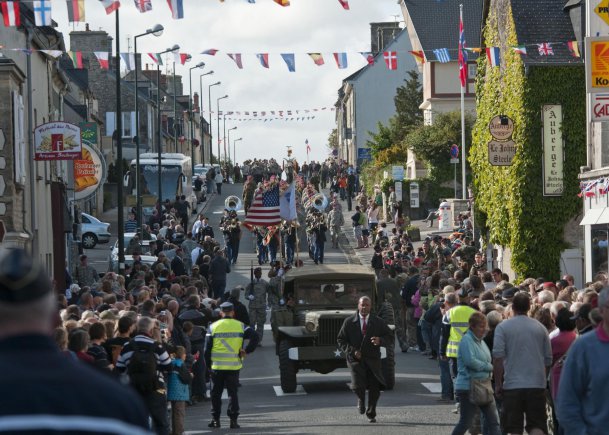 Task Force 68, which is made up of paratroopers from U.S., Germany, France, Holland, and United Kingdom, re-enacted the D-Day airborne operation on the La Fiere fields near Ste. Mere Eglise, France to commemorate the heroic acts of the World War II paratroopers who made the jump 68 years ago. After the jump, the task force marched into the town of Ste. Mere Eglise to the sounds of cheers from the locals. Task Force 68 is in Normandy, France, to commemorate the 68th anniversary of D-Day.