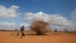 A man Walks Along the Road in Dadaab, Kenya