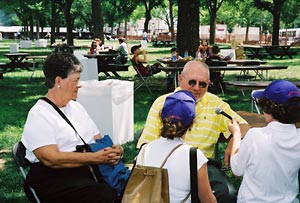 Interviewing Man in Yellow Shirt