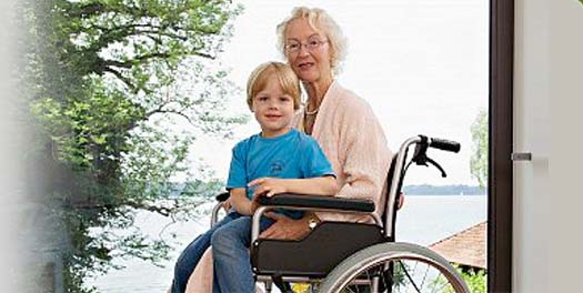 grandmother in wheelchair with child