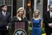 Alison A. Dickey, center, Veterans Affairs undersecretary of benefits, presents Elizabeth Carpenter, widow of Army Capt. Matthew Carpenter, with the VA's 20 millionth home loan during a ceremony at her new home in Woodbridge, Va., Oct. 26, 2012.  eterans Affairs Department photo by Robert Turtil 