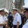 Commander, Navy Carrier Strike Group 2, chats with Commander, Coast Guard District 5