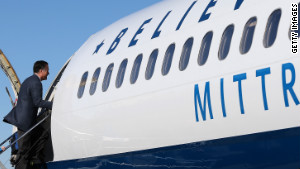 Republican presidential candidate, former Massachusetts Gov. Mitt Romney boards his campaign plane on November 6, 2012 in Bedford, Massachusetts. The Romney camp has decided to continue campaigning on the day of the election.