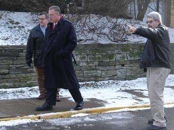 Along with Dormont officials, Congressman Tim Murphy examines drainage problems along Mattern Avenue and discusses possible solutions.
