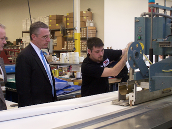 Congressman Murphy visits TMI Manufacturing, located in Pittsburgh. TMI is a leading manufacturer in industrial safety products and energy control products. Here, Murphy views the manufacturing of a plastic door used in refigeration.