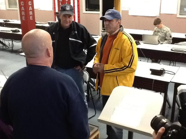 Photo: Rep. Barletta talks with officials at the Luzerne County EMA Center about the damage from super storm Sandy.