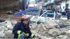 Handout picture of a firefighter at a collapsed house in San Marcos, on November 7