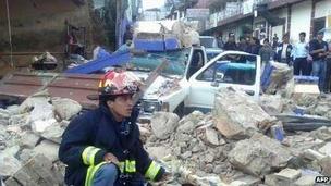 Handout picture of a firefighter at a collapsed house in San Marcos, on November 7