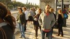 Commuters on a bus stop