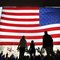 A giant American flag hangs in front of Dallas City Hall during the Veterans Day Parade on November 11, 2011.