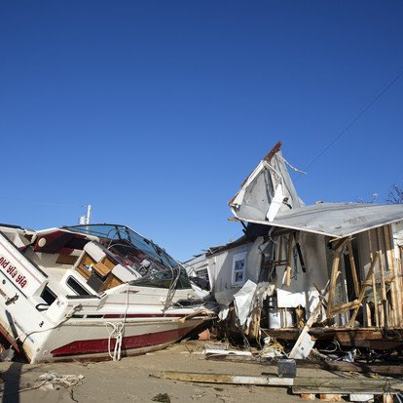 Photo: A nor'easter may bring gusty winds, heavy rain and even snow this week across much of the U.S. East Coast that was hit by Hurricane Sandy last week. | http://bloom.bg/YJT0pt

PHOTOS: Intense scenes of devastation from the aftermath of Hurricane Sandy | http://bloom.bg/SNGTa3 

Below: A damaged boat sits outside a destroyed mobile home in the Paradise Park trailer park in Highlands, New Jersey, on Nov. 3, 2012. (Victor J. Blue/Bloomberg)