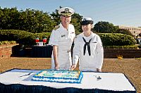 Rear Adm. Alexander Townsend, commander of Navy region Mid-Atlantic, and Information Systems Technician Seaman Felicia Donaldson cut a birthday cake at the Navy's 237th birthday ceremony at Naval Station Norfolk.