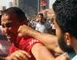 A supporter of Egypt’s Muslim Brotherhood,  right, engages a critic.