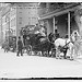 Mrs. Thos. Hastings's coach leaves Colony Club. 5/10/11. Mrs. A. Iselin, whip, Mrs. Hastings beside her, Mrs. W.G. Loew between (LOC)